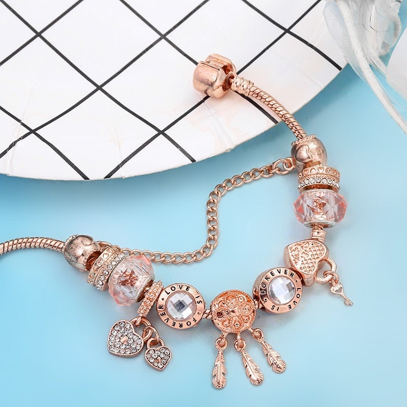 Bransoletka łapacz śnieg z różami i zawieszkami ze srebra